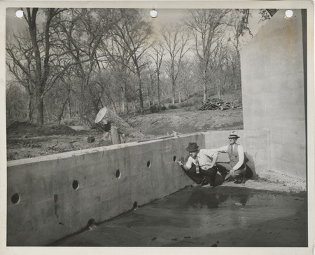 Photograph of two people inspecting culverts at Bedford State Park in Taylor County