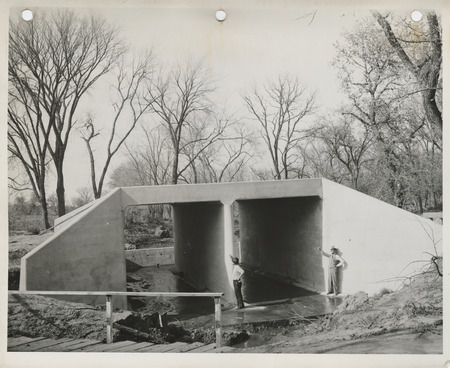 Photograph of two people inspecting culverts at Bedford State Park in Taylor County