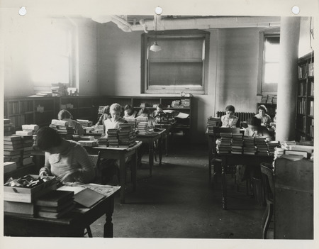 Photograph of bookbinding and repair at the city library in Des Moines