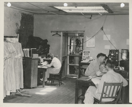 Photograph of people taking inventory of surplus commodities in Centerville