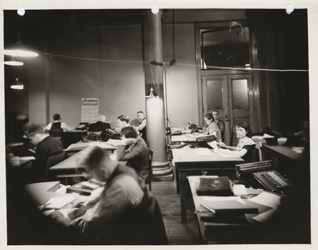 Photograph of people summarizing farm records at 110 Old Federal Building in Des Moines