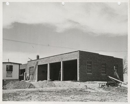 Photograph of the construction of a maintenance shed in Boone