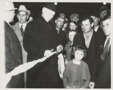 Photograph of Mayor Joe H. Allen cutting the ribbon during the dedication of the Second Avenue improvement project event