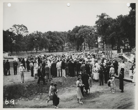 Photograph of group of people gathered during the dedication of bathhouse and shelter house in Riverview Park