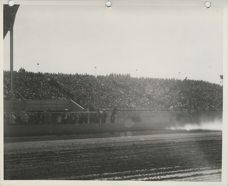Photograph of people seated on the bleachers at Clay County Fairgrounds during the 1937 fair