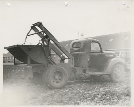 Photograph of load lugger operating in Clay County Fairgrounds