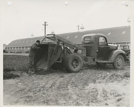 Photograph of load lugger operating in Clay County Fairgrounds