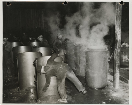 Photograph of men working at the cement tile plant in Marshalltown to build farm-to-market roads