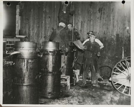 Photograph of men working at the cement tile plant in Marshalltown to build farm-to-market roads