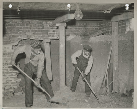Photograph of two people working at the East Side Community House in Des Moines