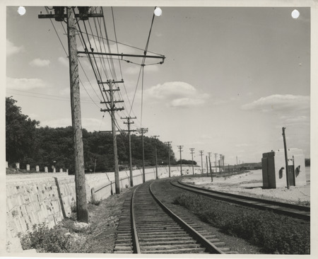 Photograph of a retaining wall along the state highway by Lindsay Park in Davenport