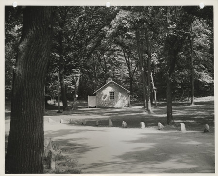 Photograph of a cabin and shelter house at Crawford Park in Fort Dodge