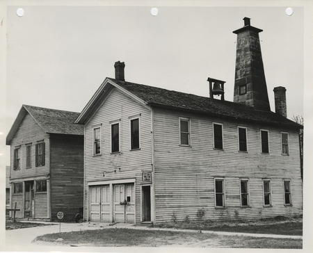 Photograph of buildings that will be razed on the city hall building site in Wilton