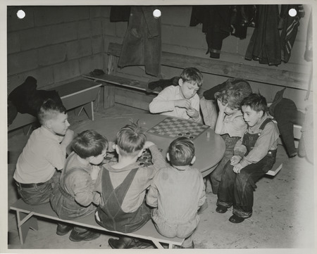 Photograph of children playing checkers in Waterloo