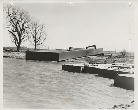 Photograph of a person working on the lake dredging project in Storm Lake