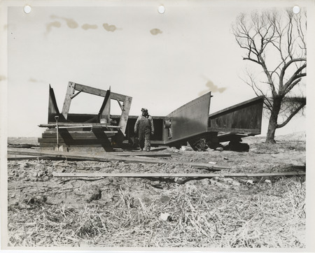 Photograph of a person with dredging equipment in Storm Lake