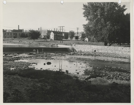 Photograph of a river dam and wall in Charles City