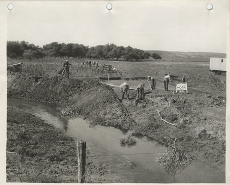 Photograph of people working on a channel change on the Skunk River in Hamilton County
