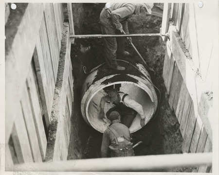 Photograph of people constructing sanitary and storm sewers in Ames