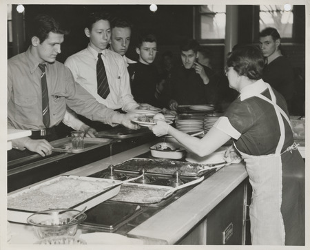 Photograph of hot lunch service at a high school in Davenport