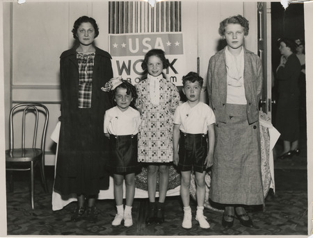 Photograph of people modeling apparel at the sewing room exhibit in Waterloo