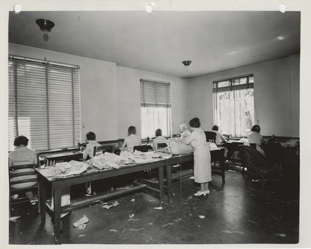 Photograph of people in a county sewing room in New Hampton