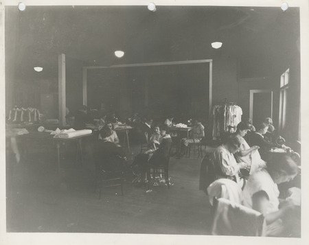 Photograph of people in a sewing room in Burlington