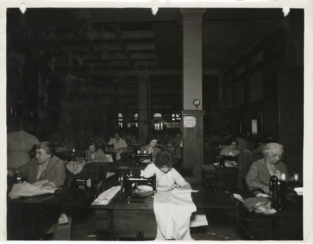 Photograph of people in a county sewing room in Dubuque