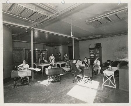 Photograph of people in a sewing room in Iowa Falls