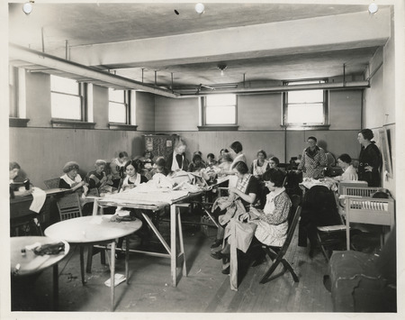Photograph of people in a sewing room in Keokuk