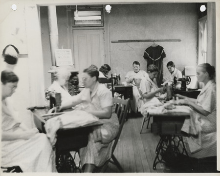Photograph of people in a sewing room in Knoxville