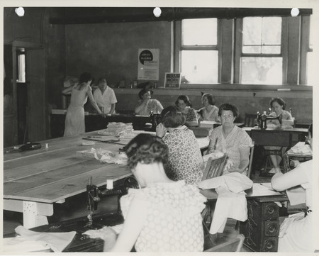 Photograph of women sewing in the sewing room in Albia