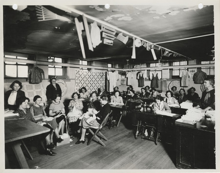 Photograph of women sewing in the sewing room of the Washington School in Council Bluffs