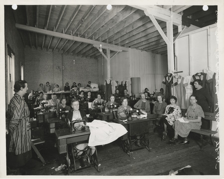 Photograph of women sewing in the sewing room at 510 Pearl Street in Council Bluffs