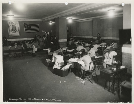 Photograph of women sewing in the sewing room of the Woodbury County Courthouse in Sioux City