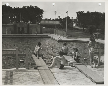 Photograph of people using the municipal swimming pool in Spencer