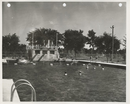Photograph of people using the municipal swimming pool in Spencer