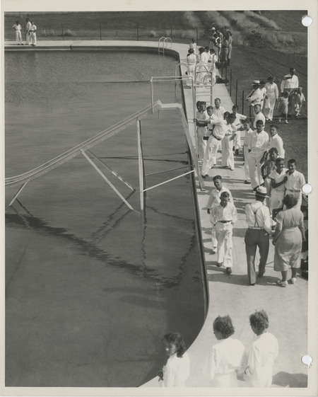 Photograph of people gathered at the municipal swimming pool in Adel