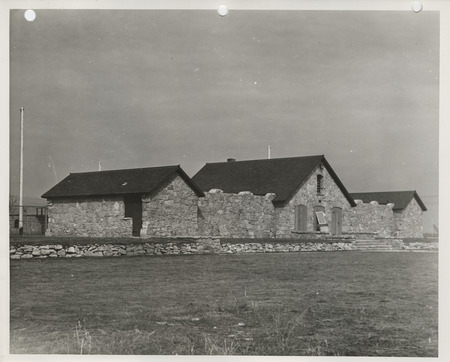 Photograph of the exterior view of the swimming pool and bathhouse in Pocahontas