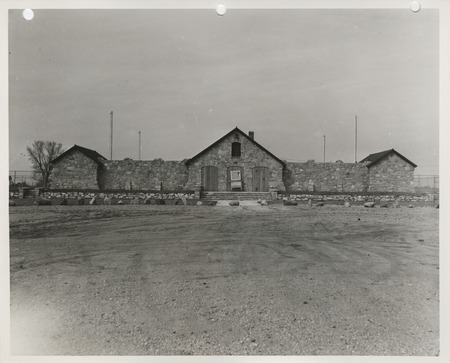Photograph of the exterior view of the swimming pool and bathhouse in Pocahontas